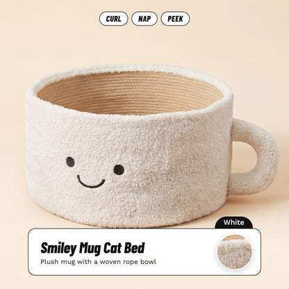 White smiley mug cat bed with a woven rope bowl, about 45 x 26 cm